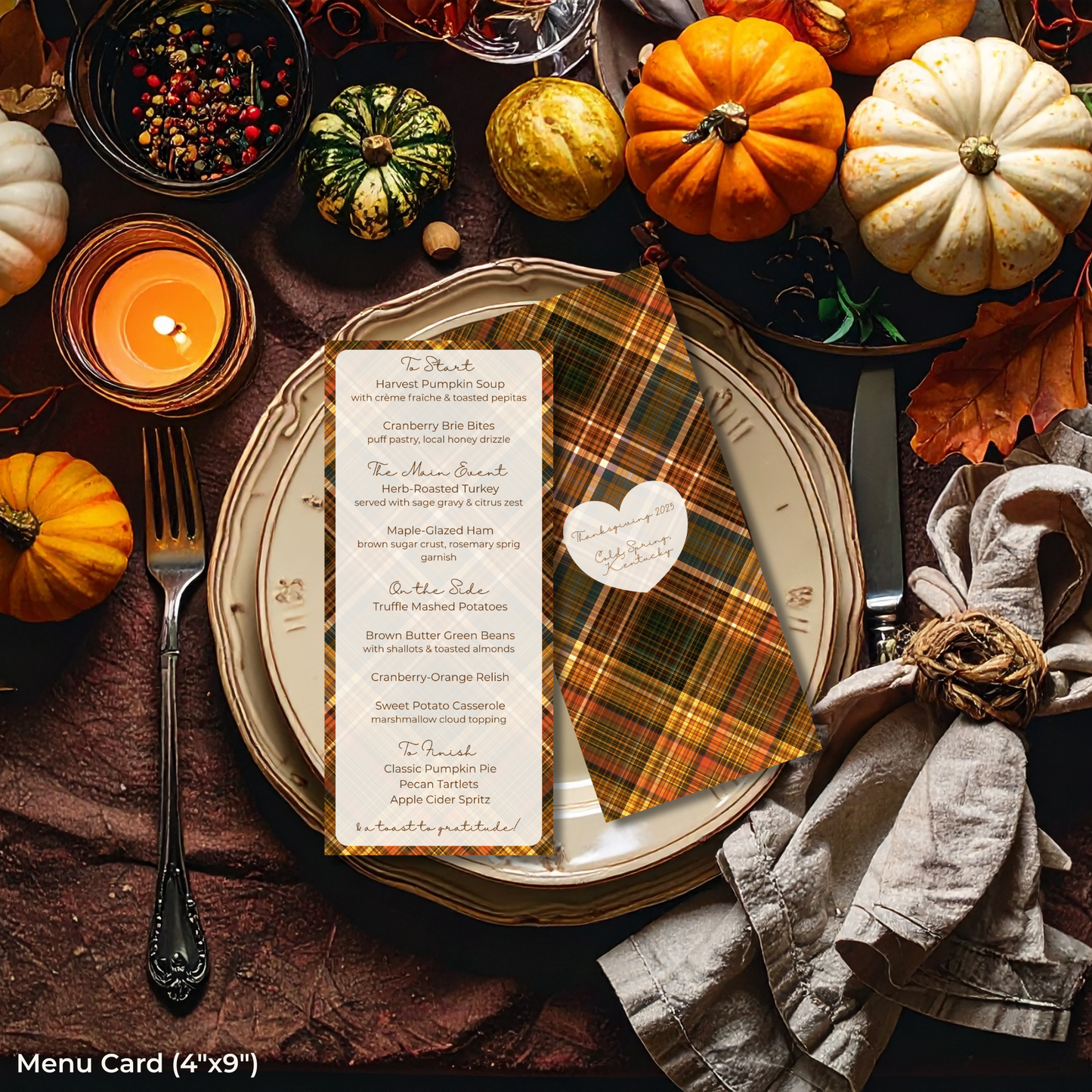 Thanksgiving table setting with pumpkins, candles, and a menu card