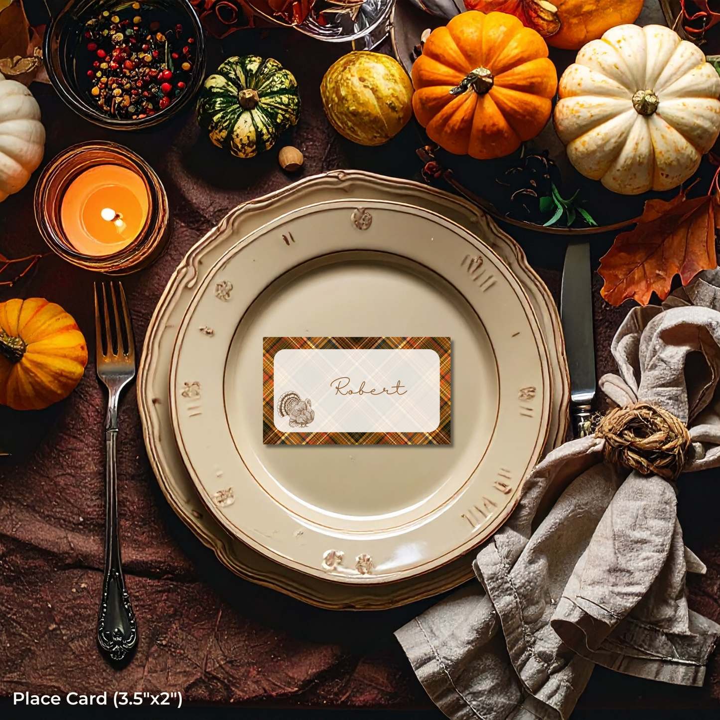 Thanksgiving table setting with pumpkins, candles, and a place card on a plate.