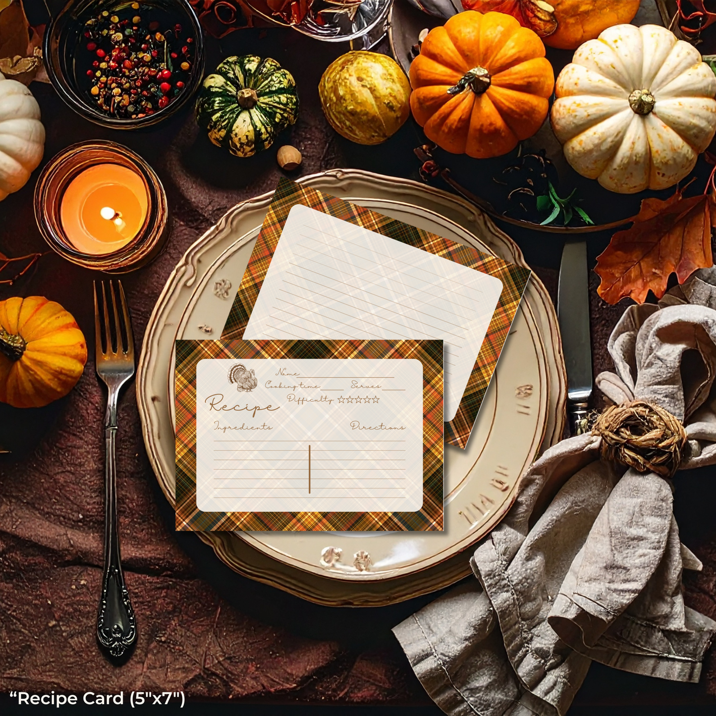 Thanksgiving table setting with pumpkins, candles, and recipe card