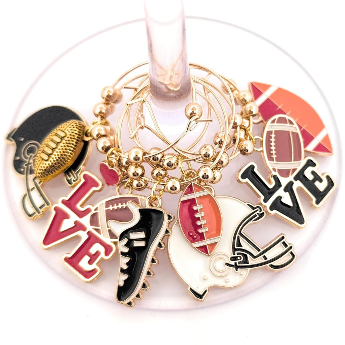 Keychain with sports-themed charms on a wine glass stem