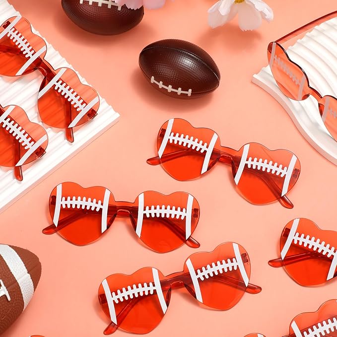 Red sunglasses with football designs on a peach background