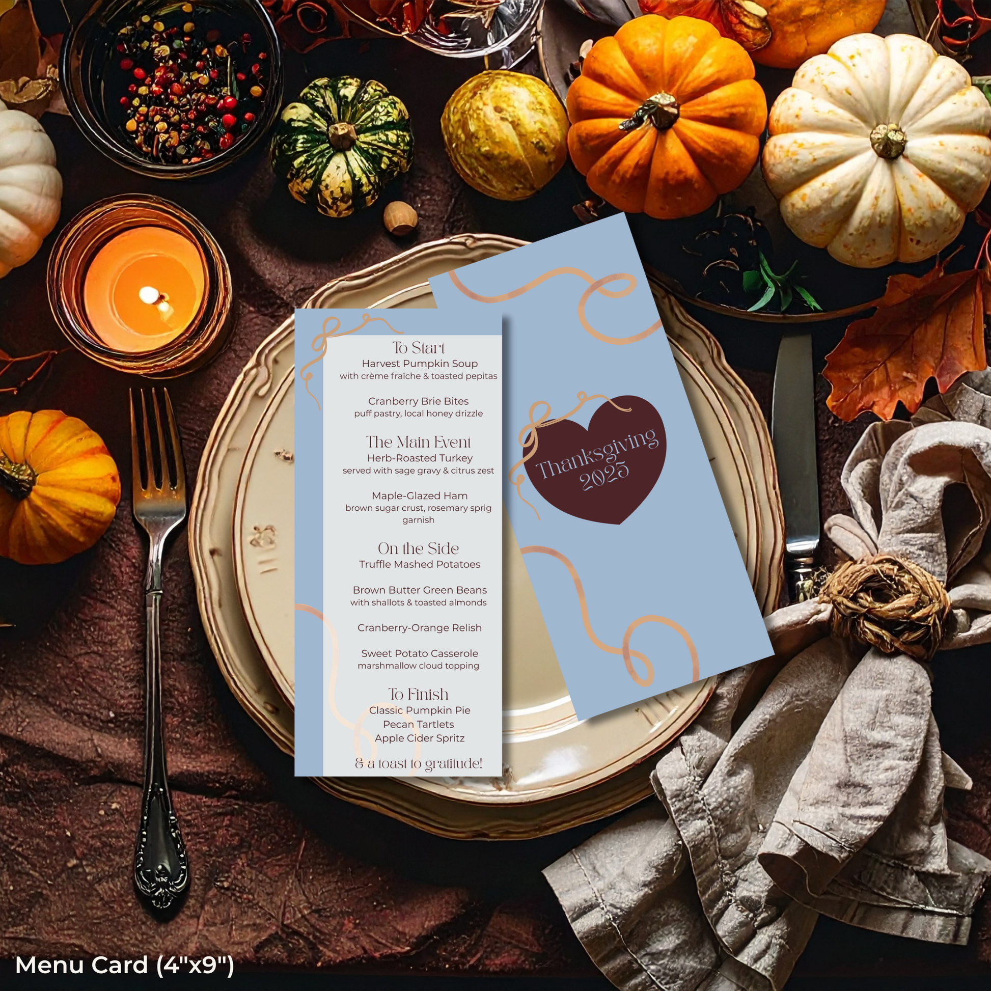 Thanksgiving table setting with pumpkins, candles, and a menu card on a wooden table.