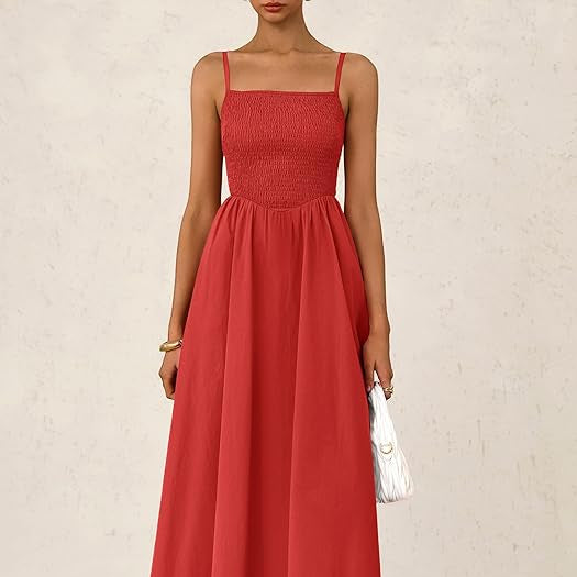 Red dress worn by a person on a plain background